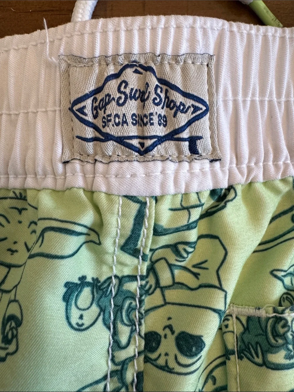 GAP Baby Yoda Print Swim Trunks in Light Green with White Waistband